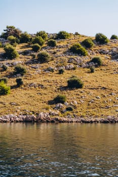 Amazing landscape with sea bay, rocky dry beach of Dugi Otok island in Adriatic Sea, Croatia