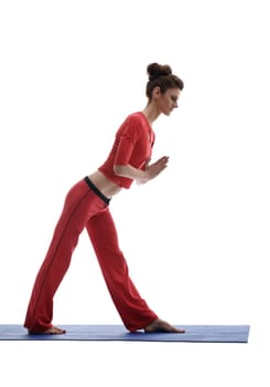 Pretty woman practicing yoga. Studio photo, isolated on white backdrop