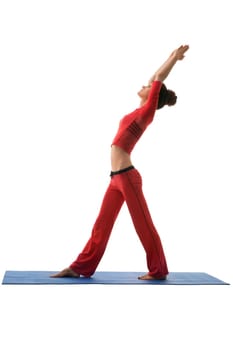 Studio photo of harmonous young woman practicing yoga