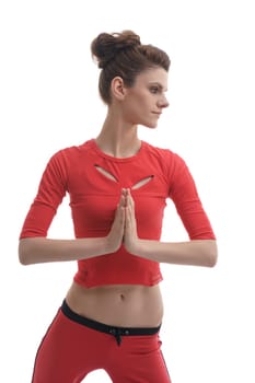 Yoga. Studio portrait of girl holding her hands in namaste