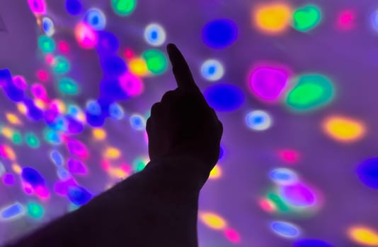 Hand gesture silhouette on a colorful background reaching out, saying hello, and show number represent for multimedia content creation