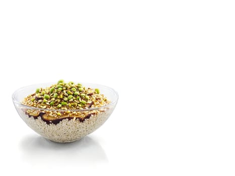 Porridge fig and honey with a sprinkle of crushed pistachios in a transparent glass bowl. Food isolated on transparent background.