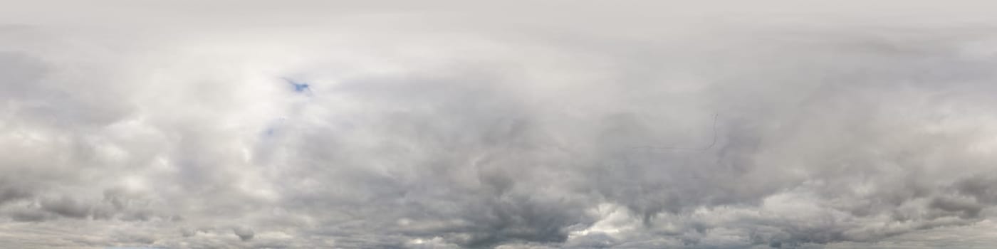 Sky panorama on overcast rainy day with low clouds in seamless spherical equirectangular format. Complete zenith for use in 3D graphics, game and for aerial drone 360 degree panorama as a sky dome.