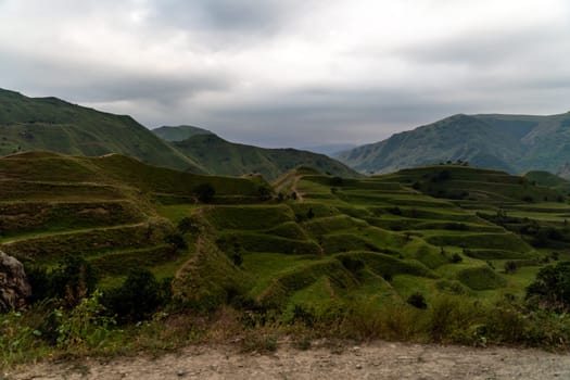 Chokhsky terraces Dagestan. Landscape of mountainous Dagestan with terraced fields and peaks mountains in the distance