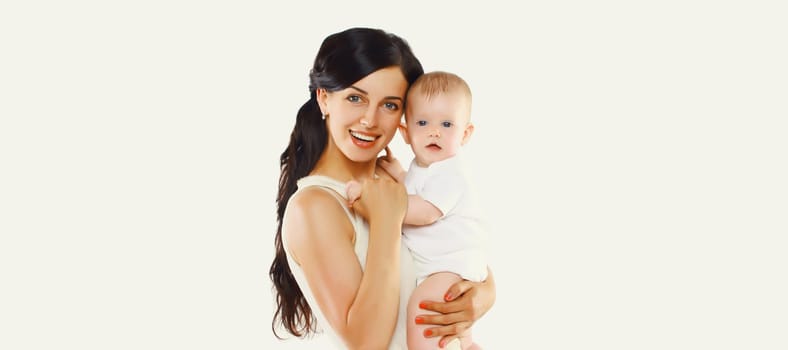 Happy cheerful smiling young mother holding baby on white studio background