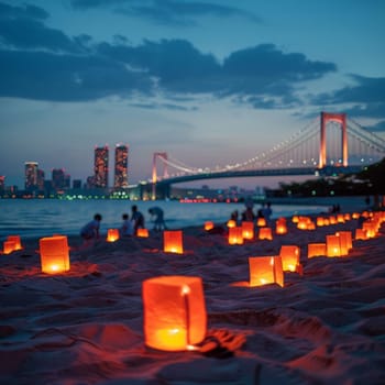 Calm dusk setting on a beach with glowing lanterns leading towards a dramatic city skyline and bridge under the early night sky. Japanese Marine Day Umi no Hi also known as Ocean Day or Sea Day.