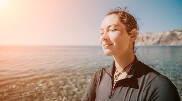 Woman travel sea. Young Happy woman posing on a beach near the sea on background of volcanic rocks, like in Iceland, sharing travel adventure journey