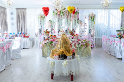 Decorated banquet hall at a gypsy wedding. Ukraine, Vinnytsia, August 10, 2021