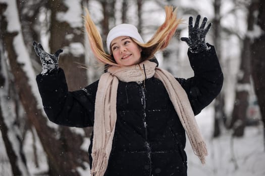 Cute positive portrait of best friend pretty young girls, winter time, neon hats, cozy sweaters, hugs and having fun, natural glowing makeup, two sisters sending air kiss, joy, couple, emotions.