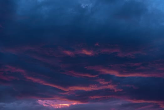 Embrace the harmonious beauty of sunrise or sunset with a sky adorned in hues of orange and blue, complemented by drifting clouds, offering a serene ambiance for your desktop