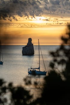 Sunset on Benirras beach in Ibiza in summer.