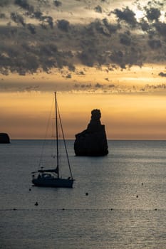 Sunset on Benirras beach in Ibiza in summer.