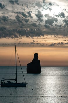 Sunset on Benirras beach in Ibiza in summer.