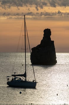 Sunset on Benirras beach in Ibiza in summer.