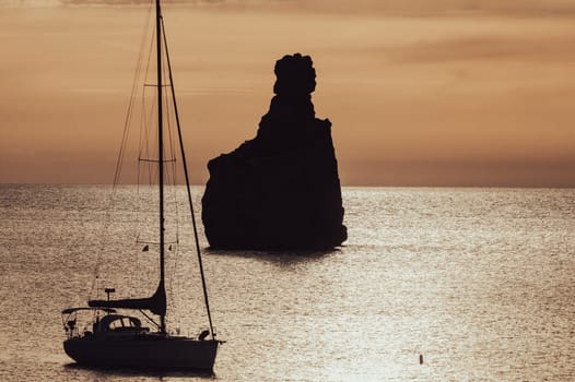 Sunset on Benirras beach in Ibiza in summer.