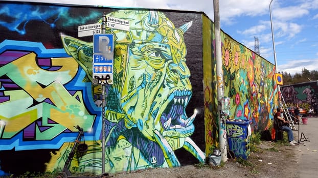 Stockholm, Snosatra, Sweden. May 12 2024. Spring beast. Graffiti exhibition on the outskirts of the city. Busker.