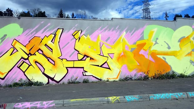 Stockholm, Snosatra, Sweden. May 12 2024. Spring beast. Graffiti exhibition on the outskirts of the city. Yellow.