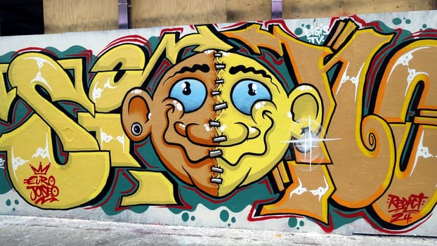 Stockholm, Snosatra, Sweden. May 12 2024. Spring beast. Graffiti exhibition on the outskirts of the city. Yellow.