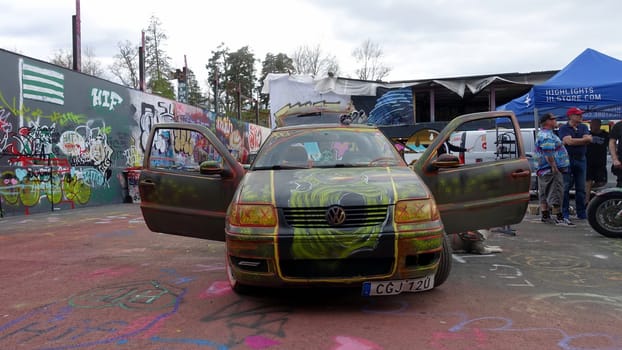 Stockholm, Snosatra, Sweden. May 12 2024. Spring beast. Graffiti exhibition on the outskirts of the city. Car.