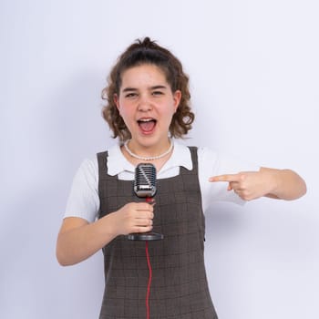 Young girl singer perform karaoke isolated on a white background