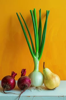 Fresh onions and pears arrangement in a vase on a vibrant yellow background for kitchen decor and cooking inspiration