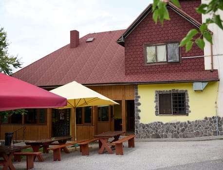 Slovakia, 29 August 2023. A beautiful cozy chalet restaurant with outdoors terrace in Slovakian village in the Carpathian mountains ridge