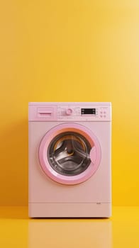 A pink washing machine is on a yellow background. The pink color of the machine contrasts with the yellow background, making it stand out. Concept of cleanliness and organization