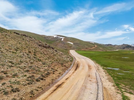 Winding mountain road surrounded by greenery on Antalya Egrigol plateau