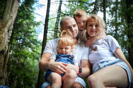 Family playing in the forest