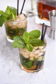 A refreshing mint julep cocktail. Made with bourbon, fresh mint and a hint of sweetness, this is the perfect drink for summer gatherings.