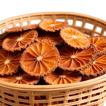 Dried salak slices in a dynamic wicker basket brown with a scaly texture a couple. Food isolated on transparent background.