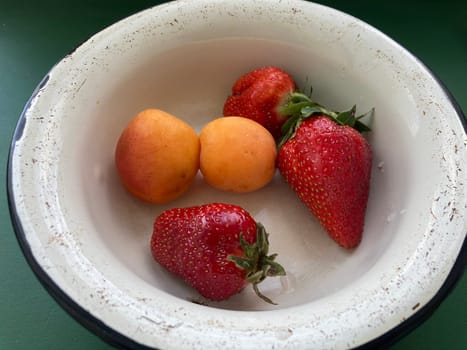 Young large strawberries grew in a the village