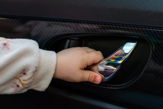 Baby arm trying to open the car door.