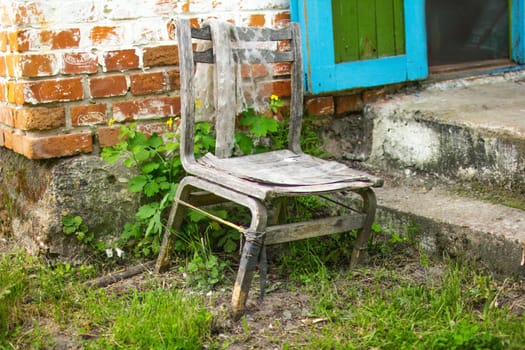 An old chair in an abandoned house. High quality photo