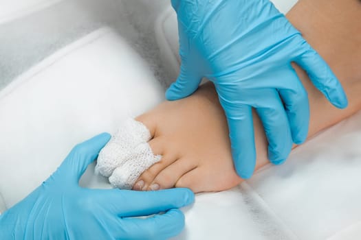 Close up bandaged toes of a patient after podiatrist treatment.