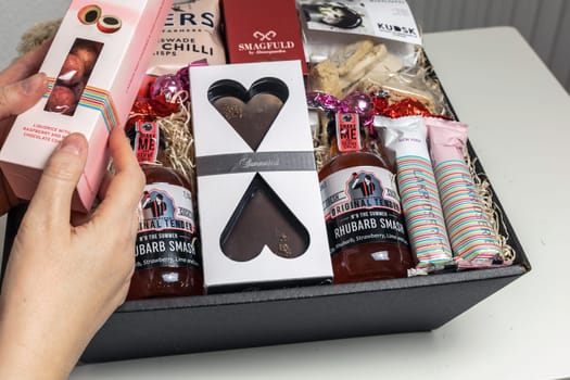 Gift box with various chocolates and snacks. Denmark - May 1, 2024