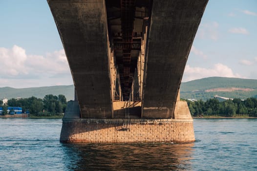 Communal bridge over the Yenisei River at beauty sunny summer day in Krasnoyarsk city.