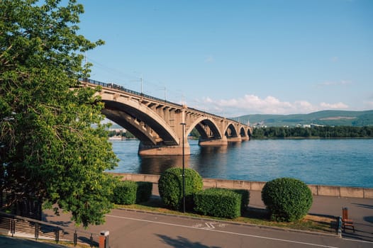 Communal bridge over the Yenisei River at beauty sunny summer day in Krasnoyarsk city.