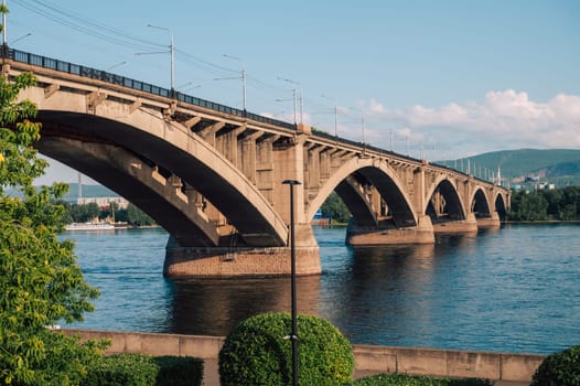 Communal bridge over the Yenisei River at beauty sunny summer day in Krasnoyarsk city.