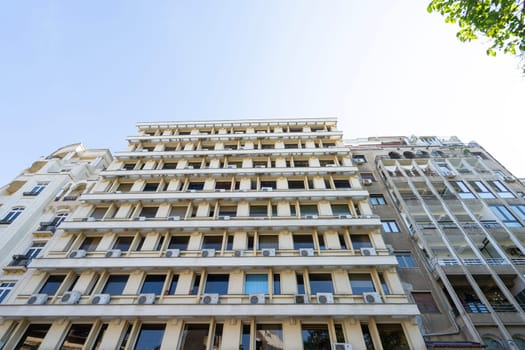 Bucharest, Romania. May 25, 2024. the air conditioners on the balconies of a building in the city center