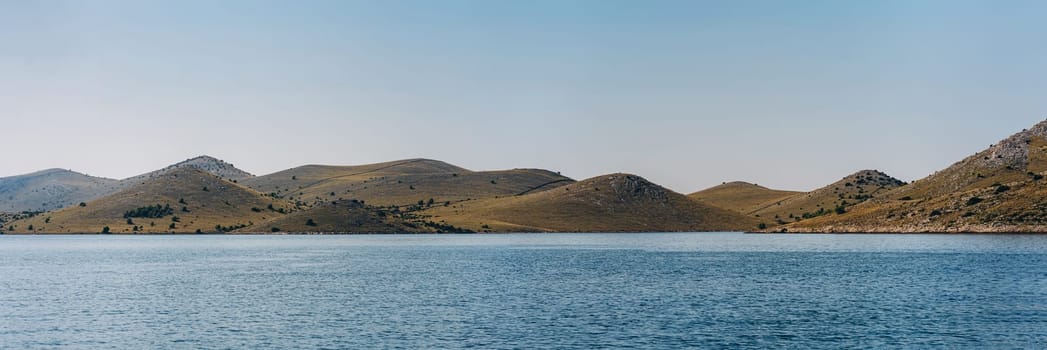 Summer wide panoramic view of Adriatic sea and mountain range in Telascica National Park, Croatia