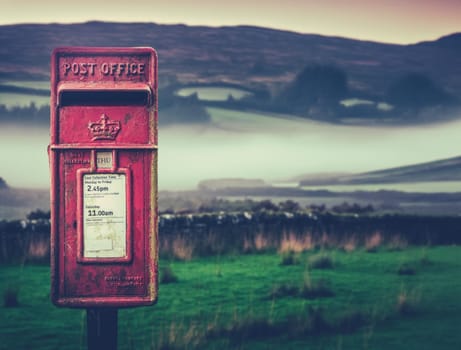 A Vintage British Post Or Mail Box In The Scottish Countryside On A Foggy Morning