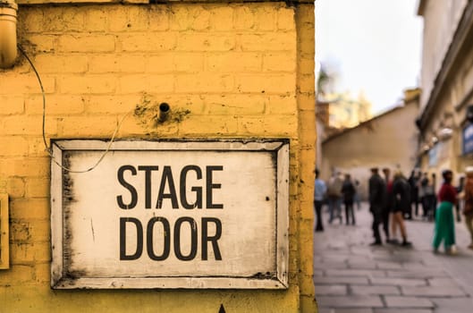 A Queue Forming Outside A Theatre Before A Performance