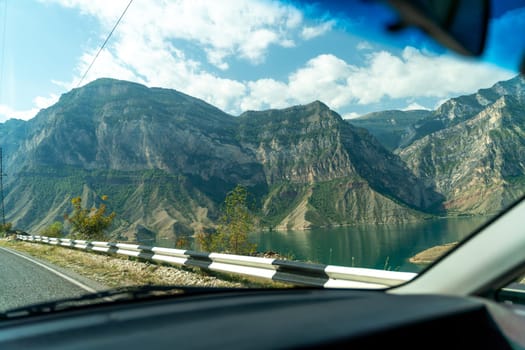 View from the car of an asphalt road in the mountainous area of Dagestan.