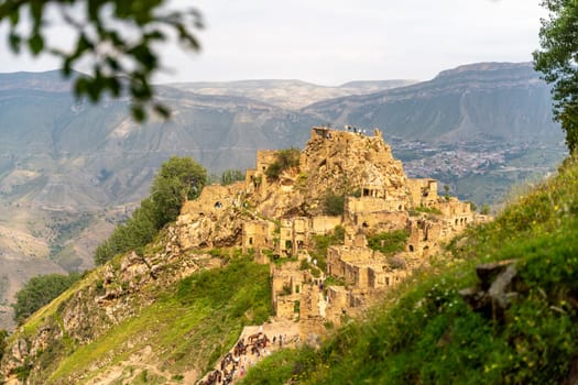 Dagestan Gamsutl. Ancient ghost town of Gamsutl old stone houses in abandoned Gamsutl mountain village in Dagestan, Abandoned etnic aul, summer landscape