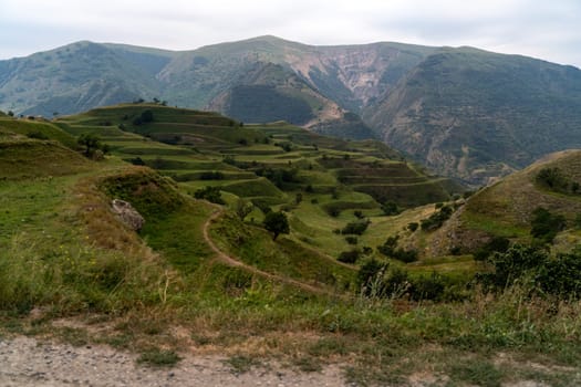 Chokhsky terraces Dagestan. Landscape of mountainous Dagestan with terraced fields and peaks mountains in the distance