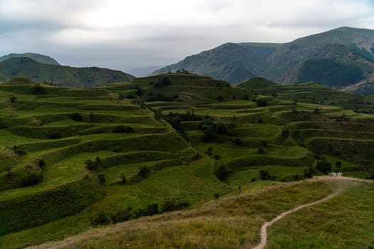 Chokhsky terraces Dagestan. Landscape of mountainous Dagestan with terraced fields and peaks mountains in the distance