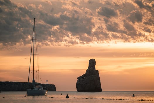 Sunset on Benirras beach in Ibiza in summer.