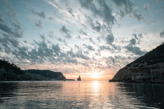 Sunset on Benirras beach in Ibiza in summer.