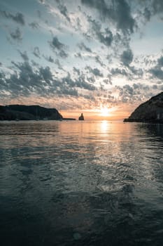 Sunset on Benirras beach in Ibiza in summer.